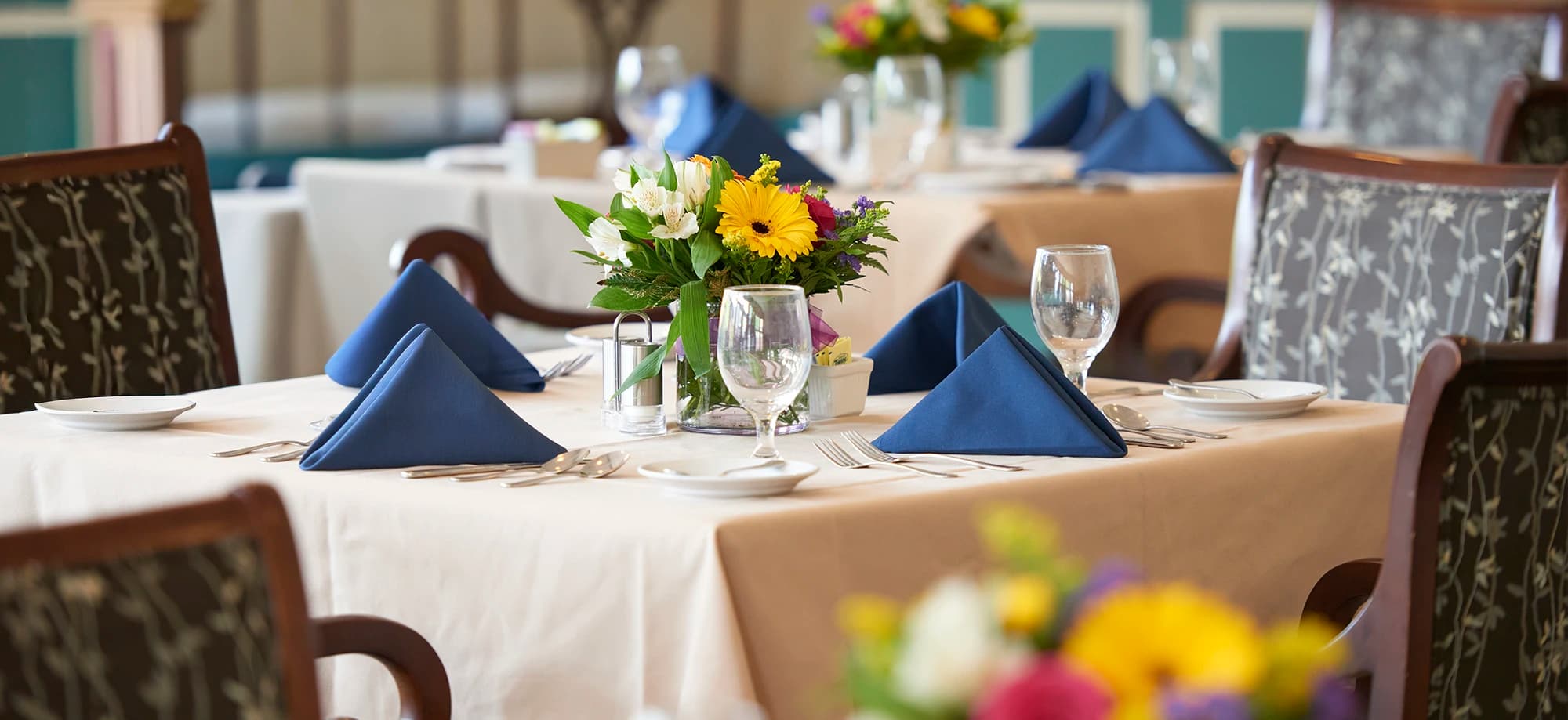 Table with flowers and plates