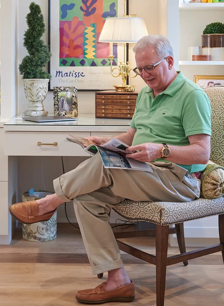 Man sitting and reading a magazine