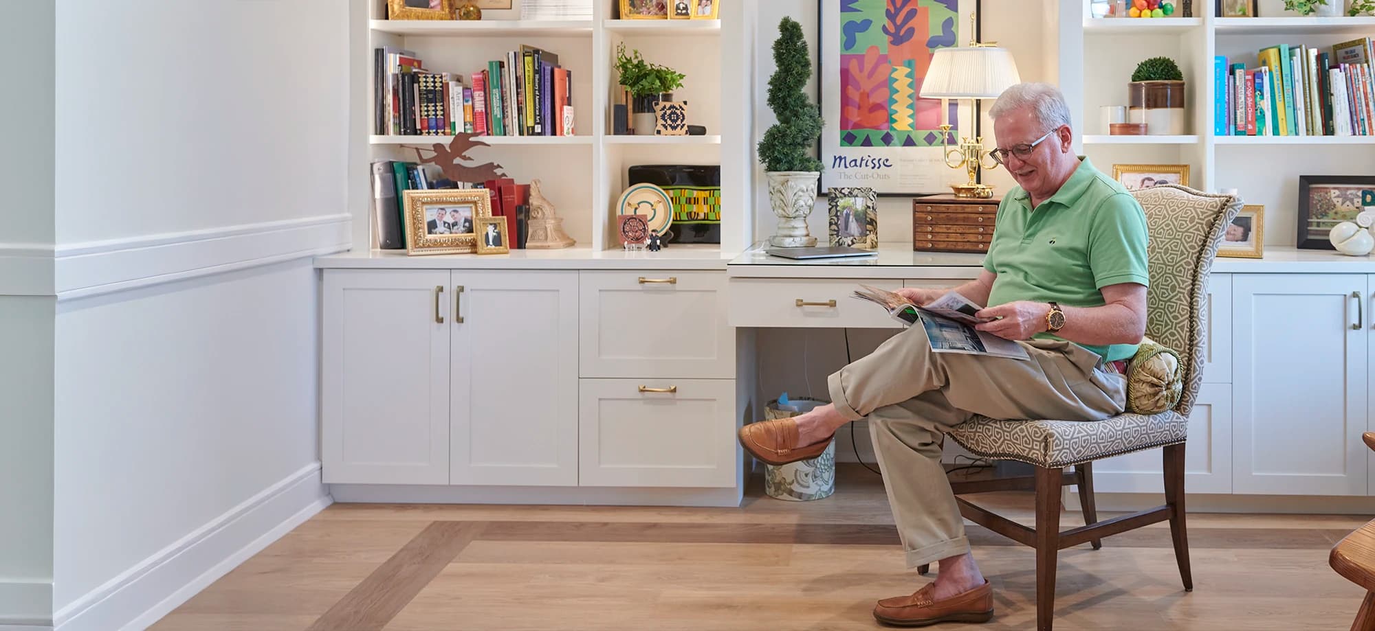 Man sitting and reading a magazine