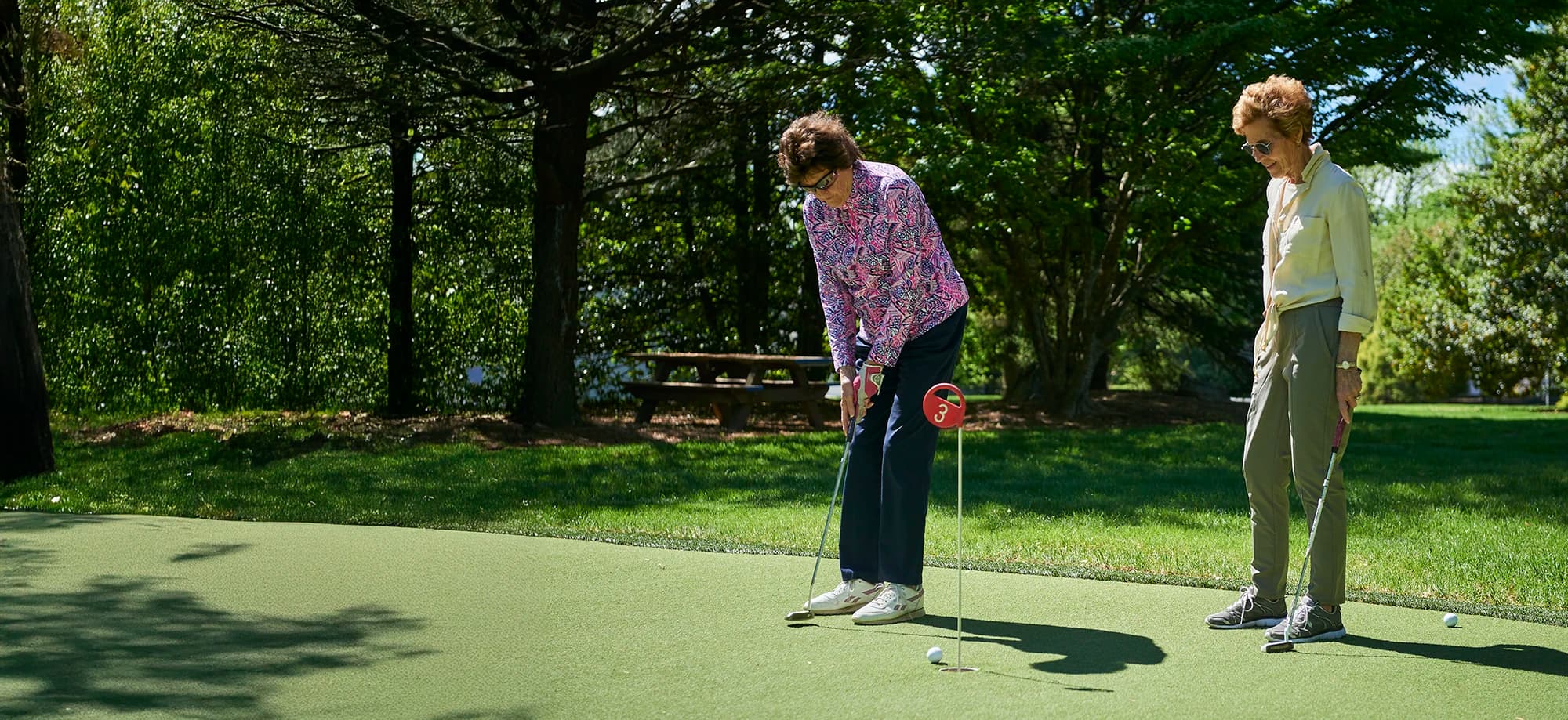 Women enjoying the putting green