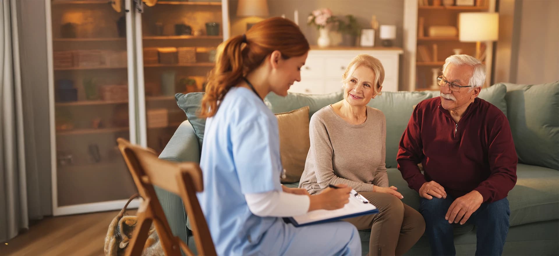 Woman taking notes with residents - wide view