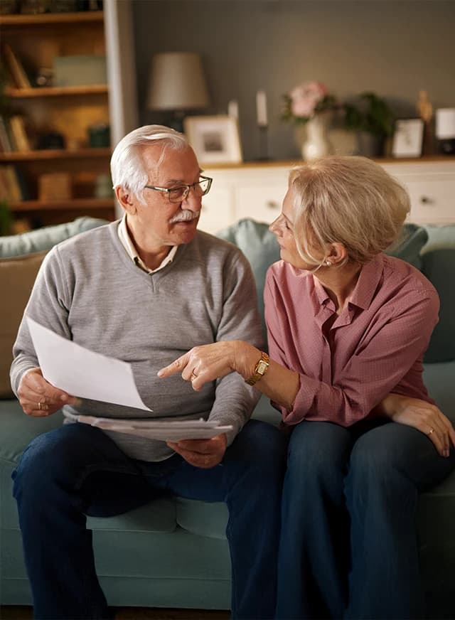 Man and woman discussing paper work